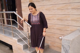 BLIND GIRL MOVING INDIPENDENTLY WITH THE HELP OF WALKING CANE